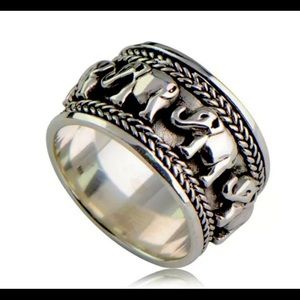 Silver ring with elephant carved patterns